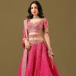 SEASONS-RANI PINK CLASSIC BRIDAL LEHENGA SET WITH ALL OVER PATTERNED HAND EMBROIDERY PAIRED WITH A MATCHING DUPATTA AND FLORAL EMBROIDERED DETAILS.